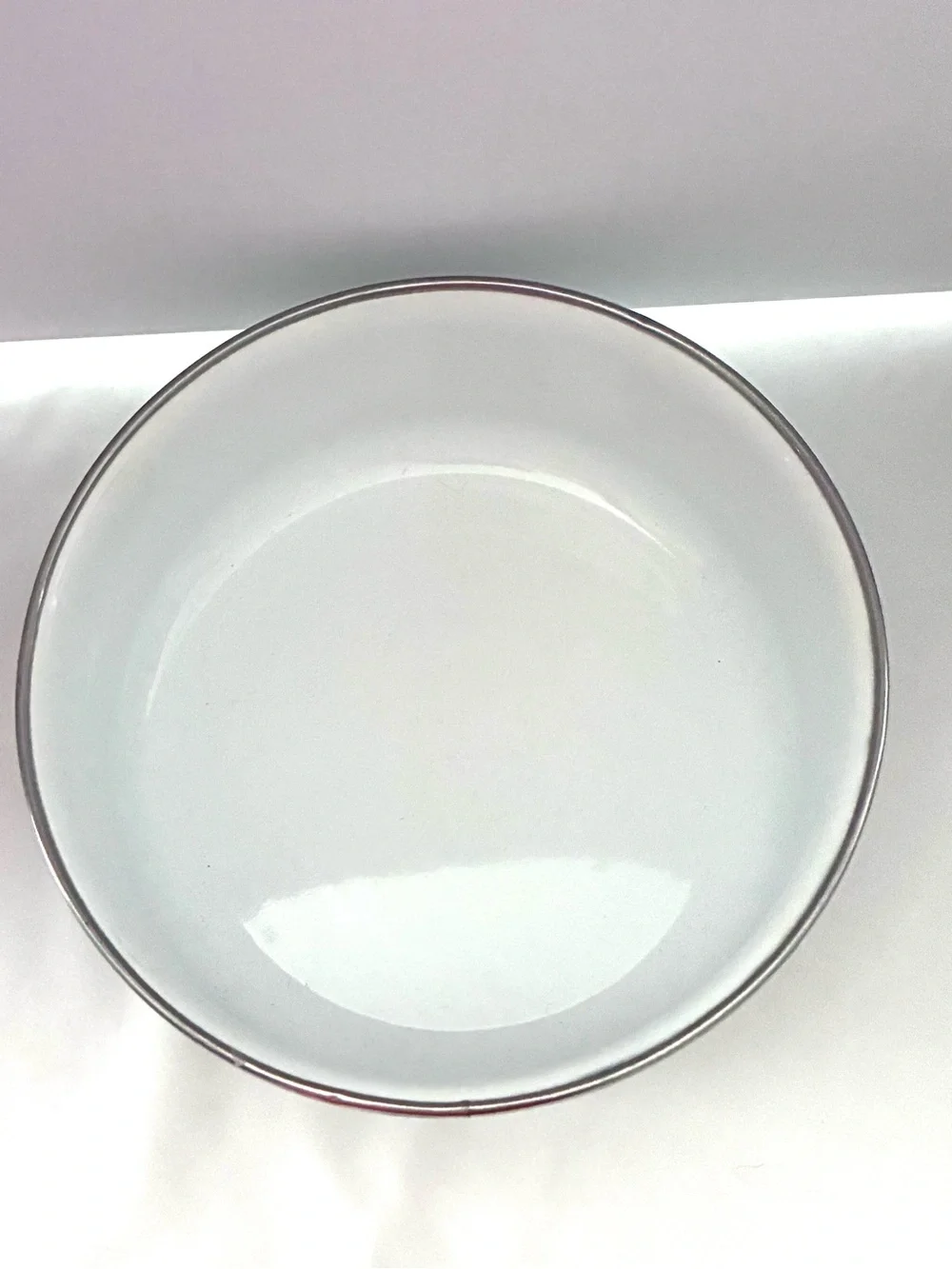 Vintage enamel mixing bowls featuring peacock and floral pattern
